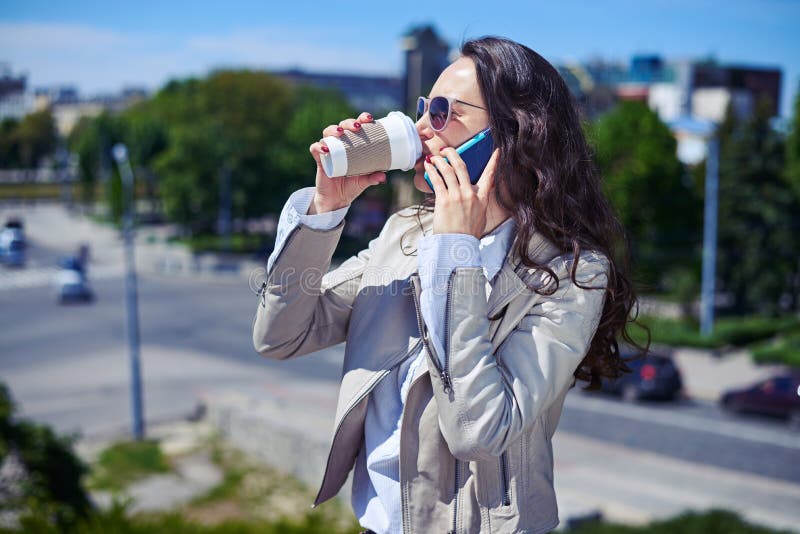 Gorgeous Lady Talking On Phone While Drinking Coffee