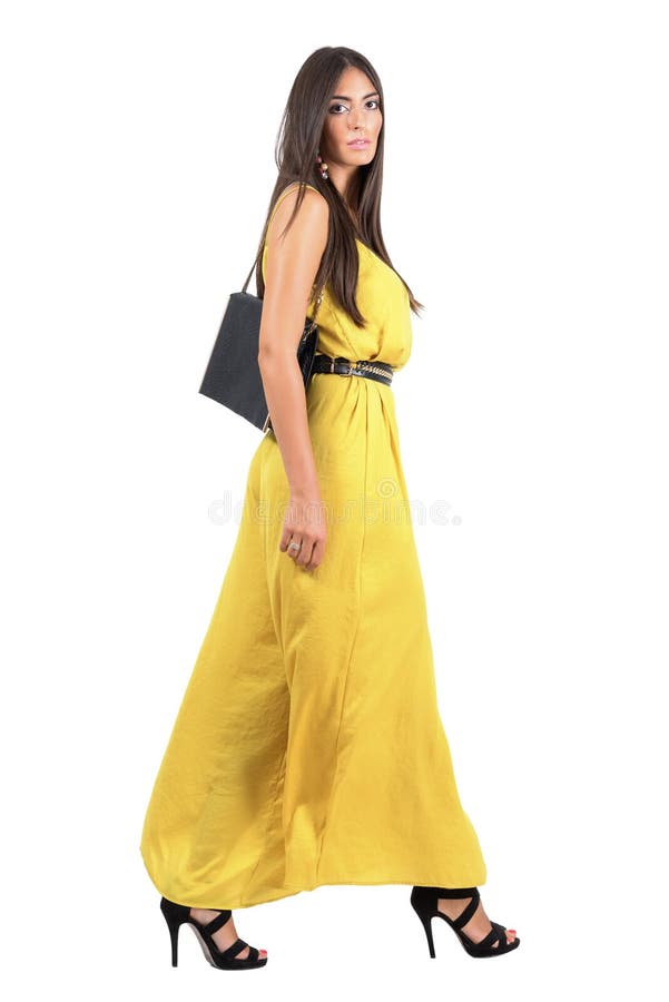 Gorgeous long hair beauty in evening dress walking side view stock images Gorgeous long hair beauty in evening dress walking side view stock images