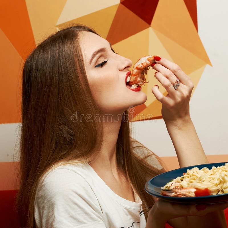 Beautiful girl enjoying her meal