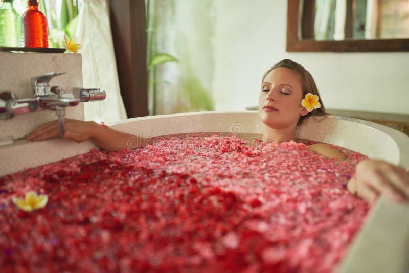 Cute blond playing with herself in the bath