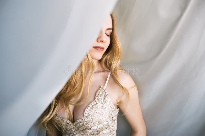 Gorgeous woman at underwear posed at studio against white curtains. stock image Gorgeous woman at underwear posed at studio against white curtains. stock image