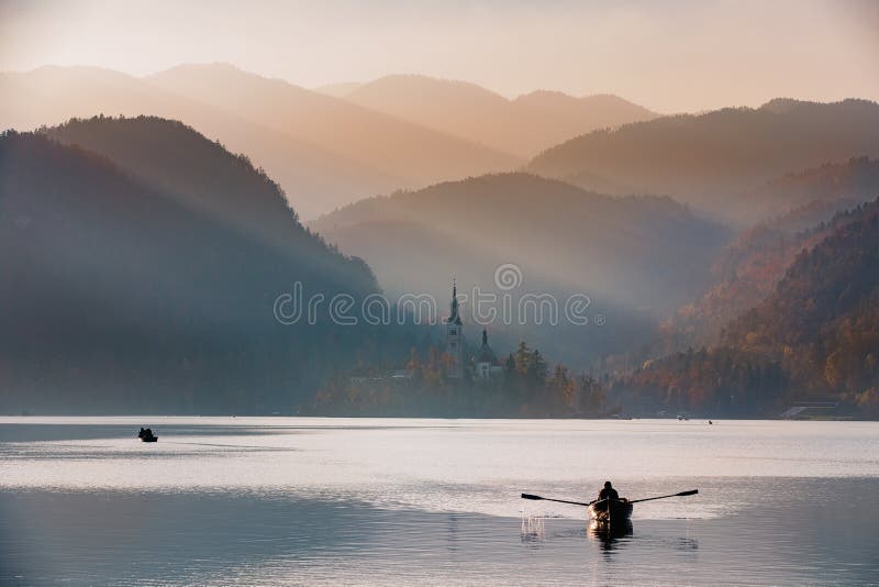 Bled Lake in the sunset with boat royalty free stock images Bled Lake in the sunset with boat royalty free stock images