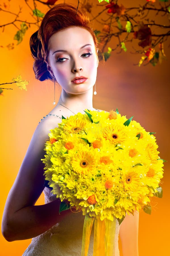 Gorgeous woman with bouquet of flowers