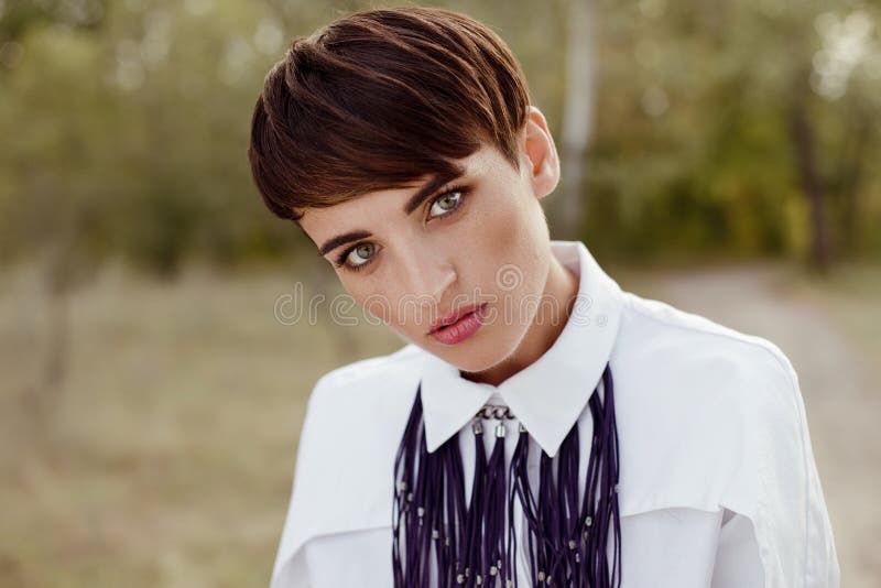 Gorgeous woman with short hair posing outdoors royalty free stock photo Gorgeous woman with short hair posing outdoors royalty free stock photo