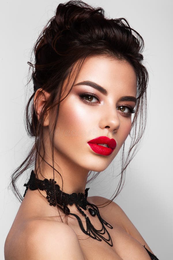 Gorgeous Young Brunette Woman face portrait. Red lips