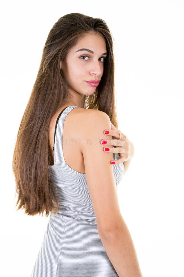 Young Model Woman With Perfect Brunette Hair Looking At Camera Posing