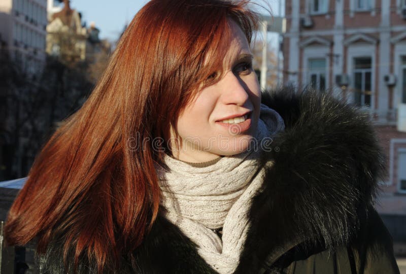 A portrait of a young girl who looks away, and a bright winter sun. Looks carefully to the side stock photos A portrait of a young girl who looks away, and a bright winter sun. Looks carefully to the side stock photos