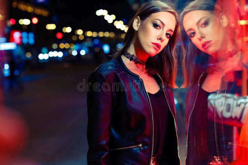 Gorgeous young woman posing at night city royalty free stock images Gorgeous young woman posing at night city royalty free stock images