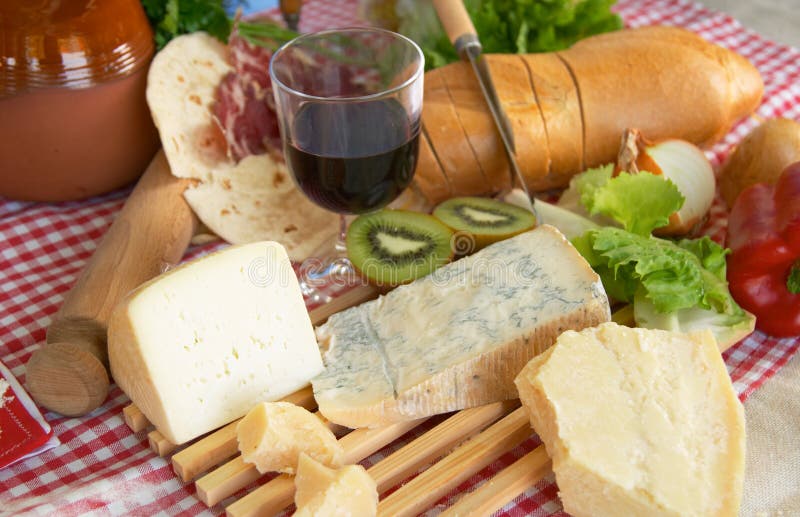 Gorgonzola, parmigiano, pecorino cheese, with wine and bread