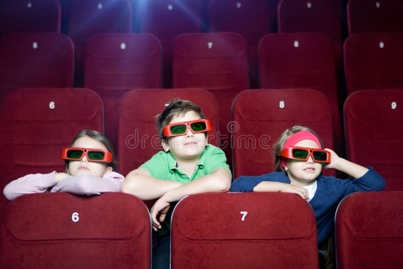 Kids watching 3D cartoon in the movie theater. Kids watching 3D cartoon in the movie theater