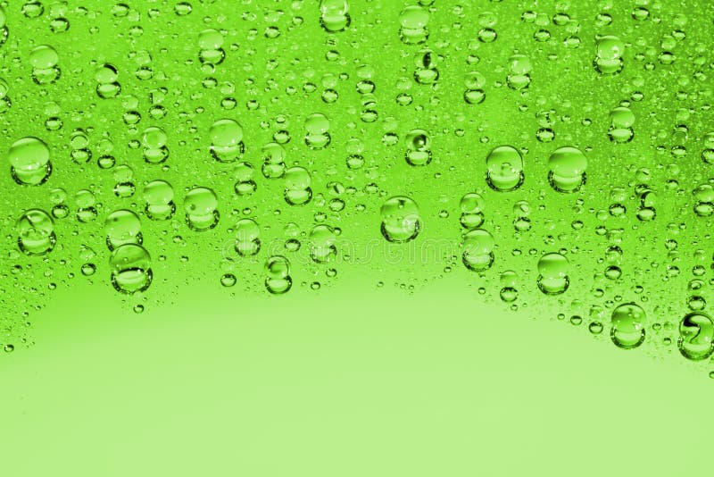 Gotas verdes del agua fotografía de archivo libre de regalías Gotas verdes del agua fotografía de archivo libre de regalías