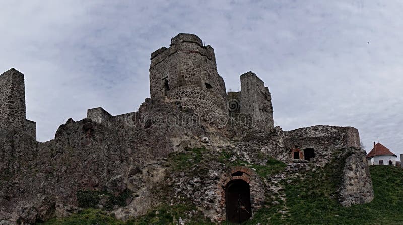 Gothic part of castle Levice, Slovakia, against spring blue sky