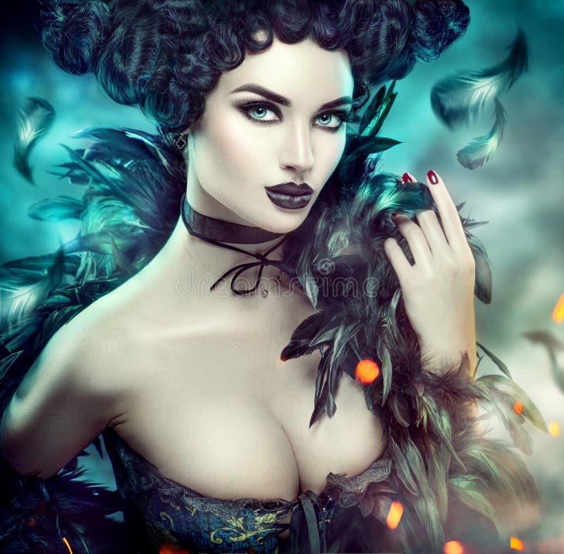 Gothic sexy young woman. Halloween. Beautiful model girl with fantasy makeup in goth costume with black feathers