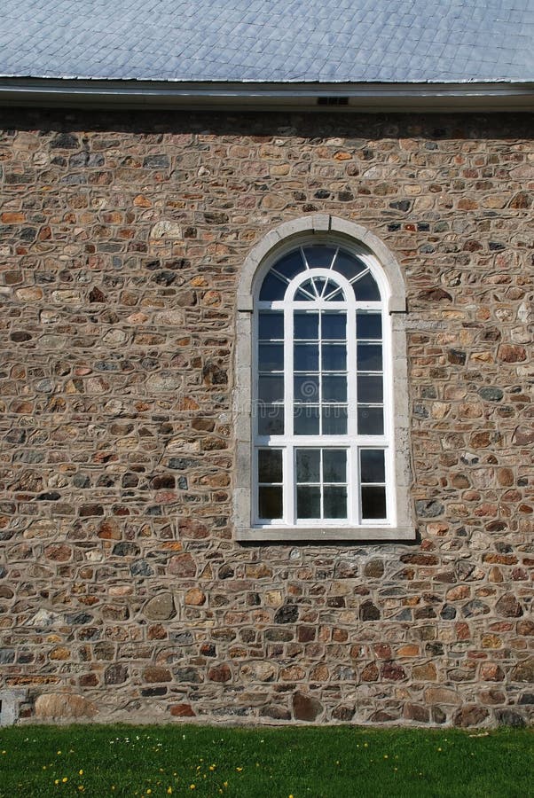 Gothic window on church in stone