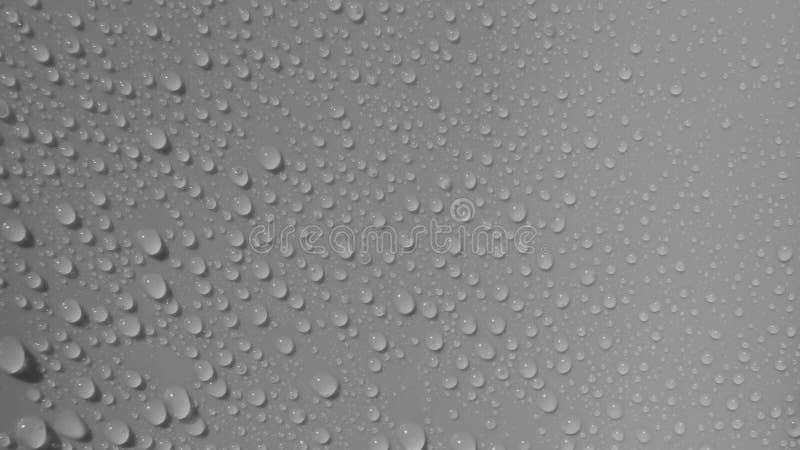 Details of beads of water or droplets on a gray surface. Details of beads of water or droplets on a gray surface.