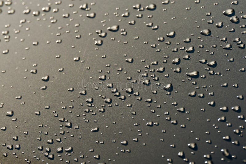 Water droplets on the paint of a car. Water droplets on the paint of a car