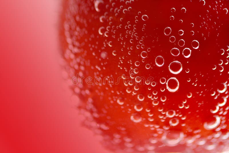 Bubbles and droplets of water over red background. Bubbles and droplets of water over red background.