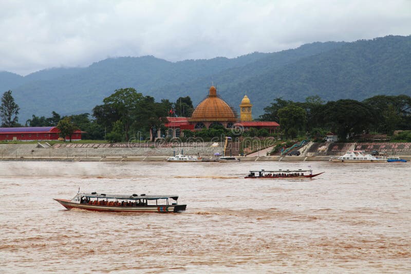 Golden Triangle Special Economic Zone, Laos - August 04 2012: This special economic zone on the bank of the Mekong River is a 99-year lease made from the Laotian government to the Chinese-owned Kings Romans Group. The group obtain 10,000 hectares with 3,000 of those as a duty-free zone. The group built many casinos to attract wealthy Chinese. Golden Triangle Special Economic Zone, Laos - August 04 2012: This special economic zone on the bank of the Mekong River is a 99-year lease made from the Laotian government to the Chinese-owned Kings Romans Group. The group obtain 10,000 hectares with 3,000 of those as a duty-free zone. The group built many casinos to attract wealthy Chinese