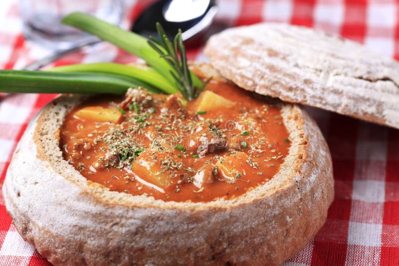Goulash in a bread bowl stock image. Image of potato 13526047