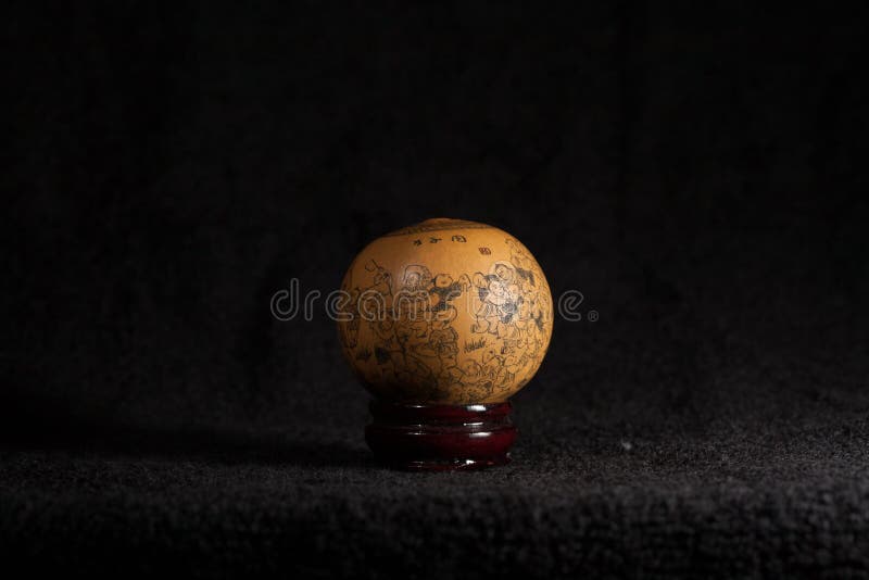 A dried gourd with relief on it. The relief bless people has lots of kids. A dried gourd with relief on it. The relief bless people has lots of kids.