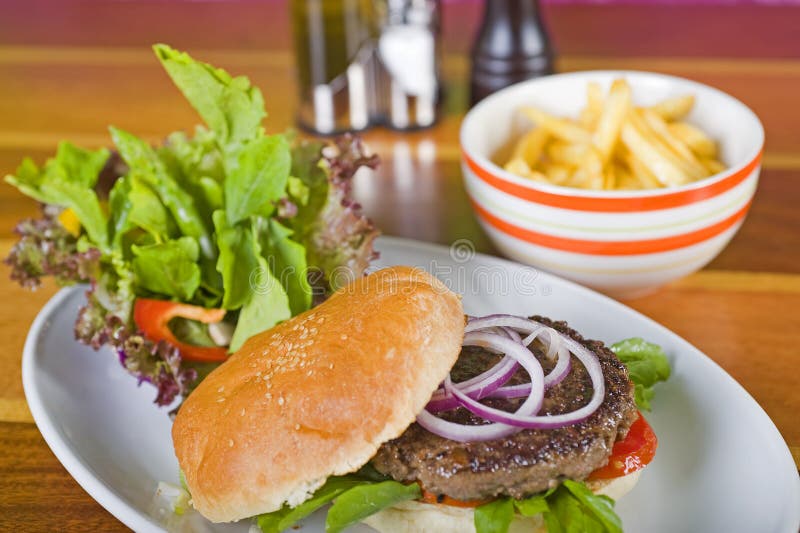 Gourmet burger with salad and fries