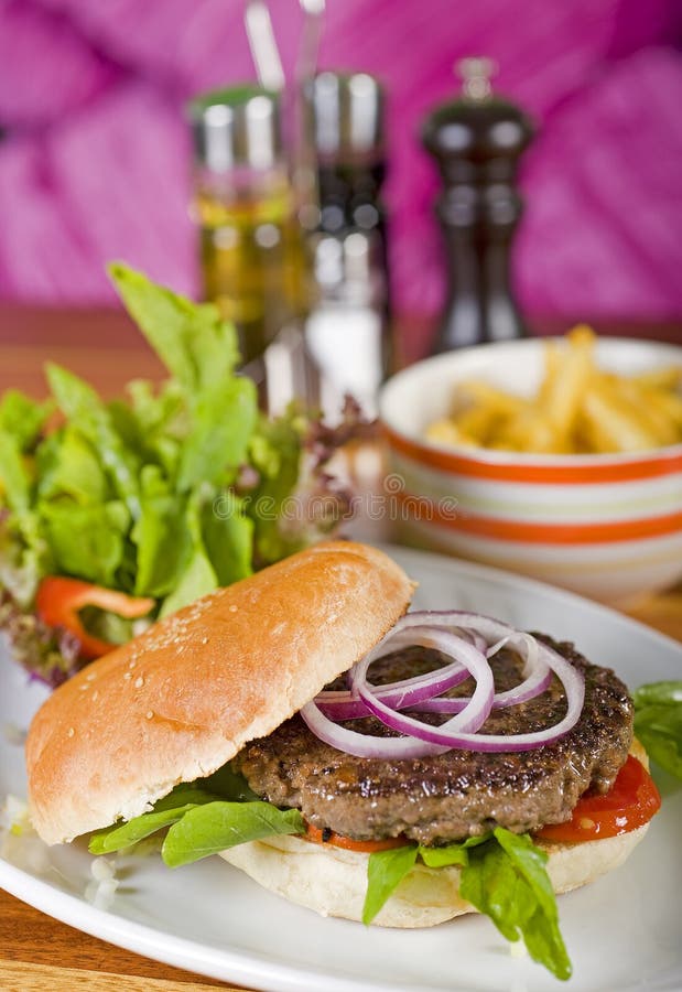 Gourmet burger with salad and fries