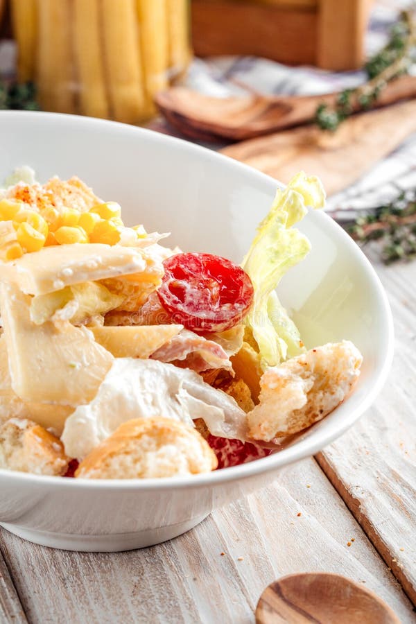 A Gourmet Caesar Salad with Fresh Vegetables and Grilled Meat Generated
