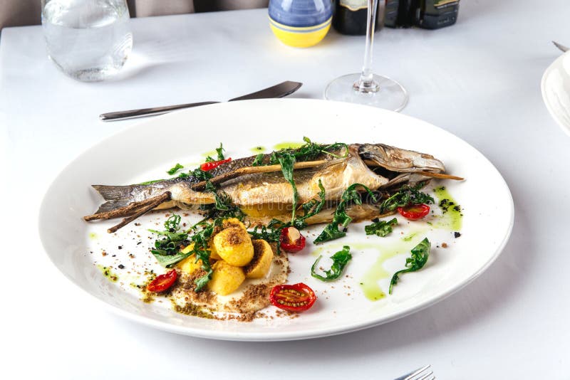 Gourmet Roasted Sea Bass on the Restaurant Table Stock Photo Image of