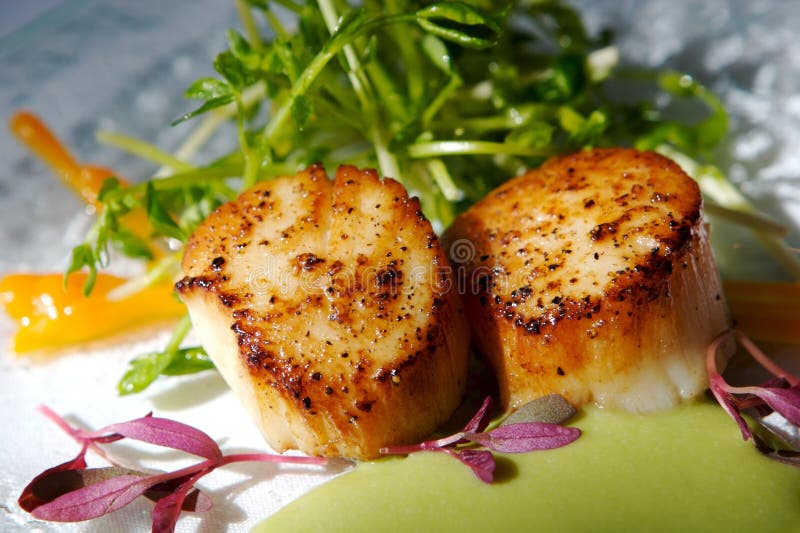 Gourmet seared scallops with garnishes