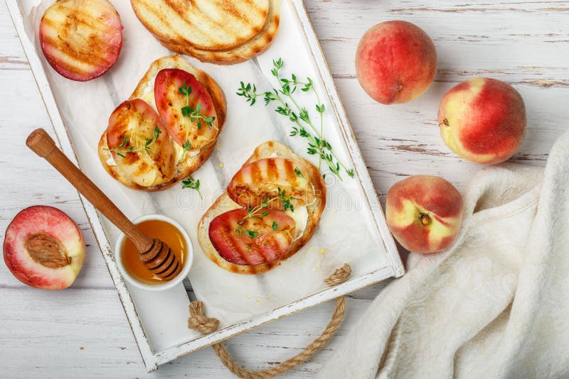 Gourmet summer Breakfast - sandwiches bread toast, bruschetta with grilled peaches royalty free stock images Gourmet summer Breakfast - sandwiches bread toast, bruschetta with grilled peaches royalty free stock images