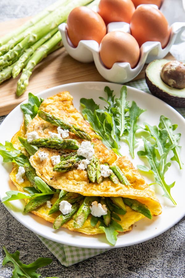 Gourmet Tasty Egg Omelette with Asparagus and Soft Cheese. Asparagus