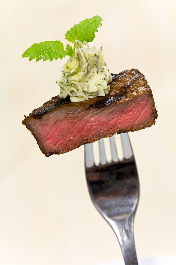 Gourmet Time,piece of a grilled steak with herb