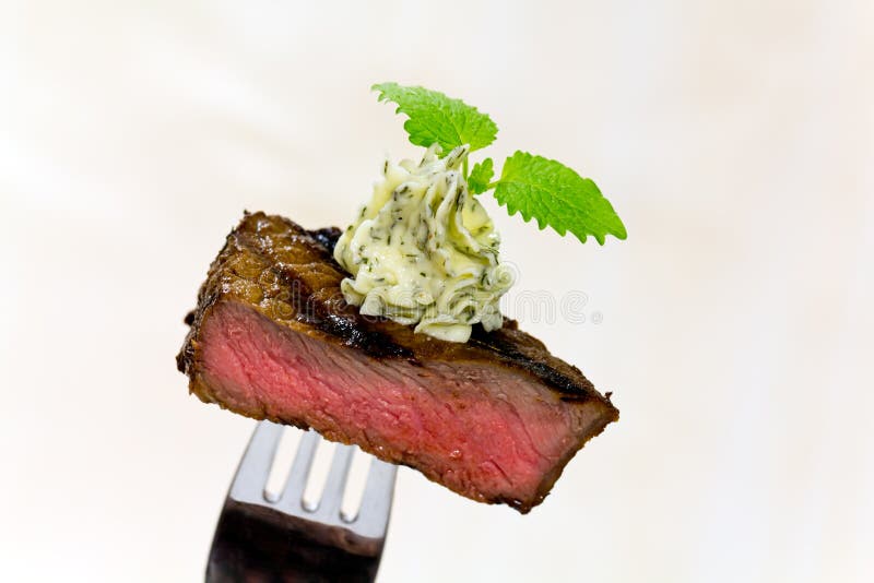 Gourmet Time,piece of a grilled steak with herb