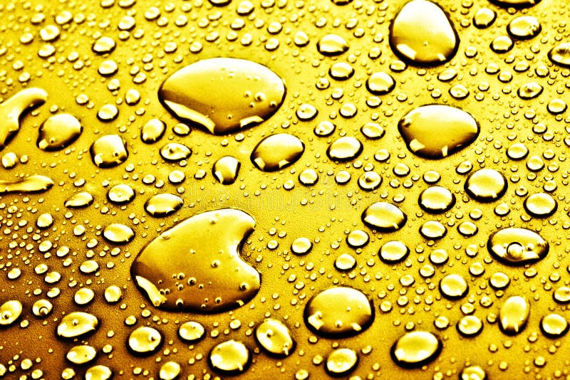 Gouttes de l'eau d'or photos stock Gouttes de l'eau d'or photos stock