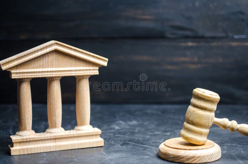 Government building and judge`s hammer. concept of state administration and economic institutions. Municipality, government, elec royalty free stock image