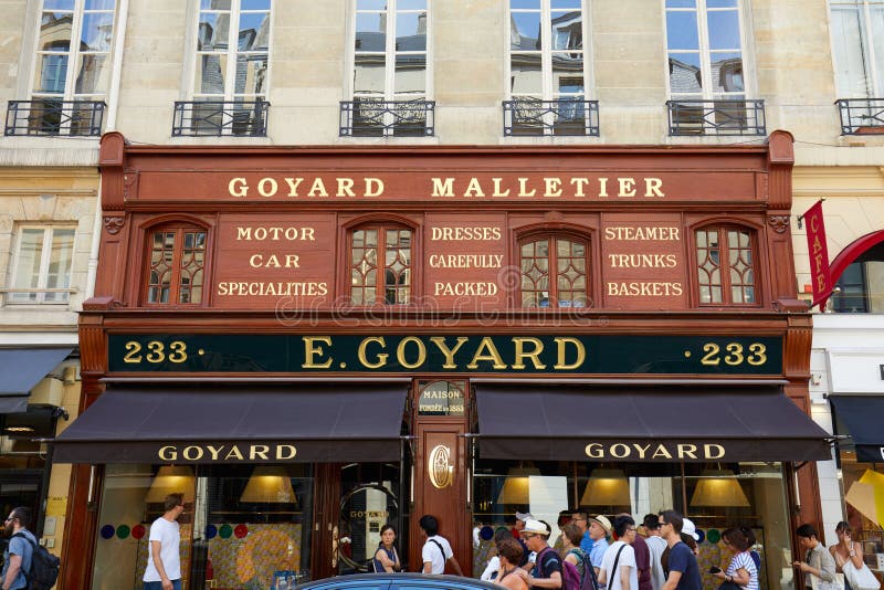 Goyard luxury store in Paris, ancient black sign with golden