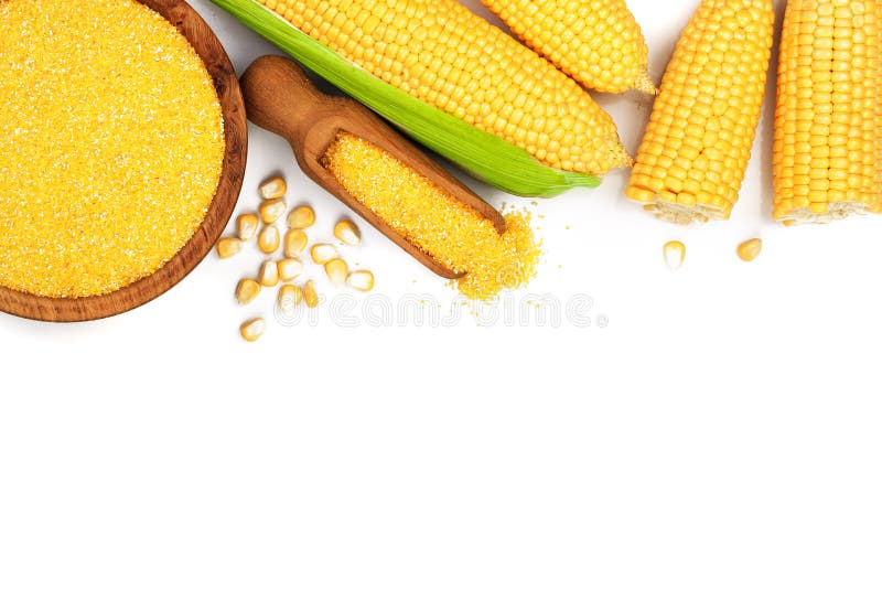 Corn groats or cornmeal in wooden bowl and corncob isolated on white background. Top view. Flat lay. Corn groats or cornmeal in wooden bowl and corncob isolated on white background. Top view. Flat lay.