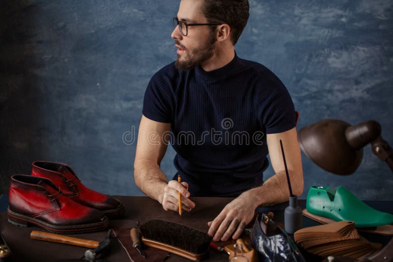 Guy working in a shoe trade, puzzled man trying to solve some problems. Guy working in a shoe trade, puzzled man trying to solve some problems.