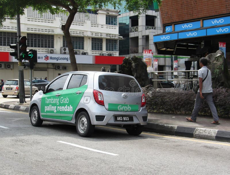 Grab Vehicle With Promotional Ads Painted Around Its Side 