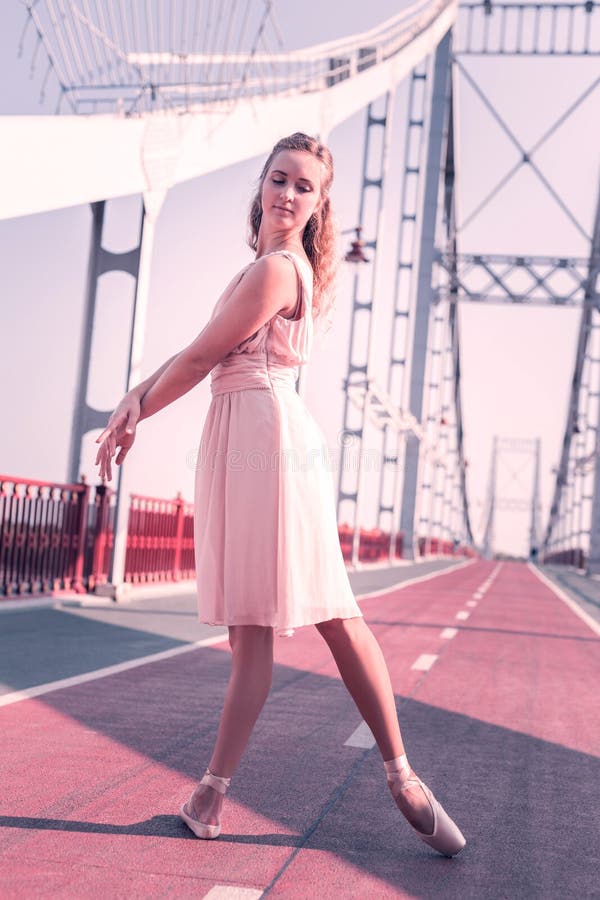 Beautiful nice young woman performing a dance