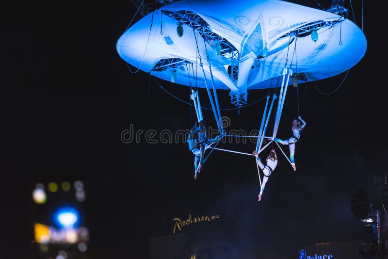 Graceful dancers at Street Theater Festival in Bucharest. Aerial acrobatics performed on overturned stage