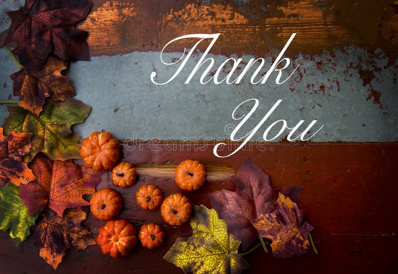 Thank you note on wooden vintage table with pumpkins and leaves. Thank you note on wooden vintage table with pumpkins and leaves
