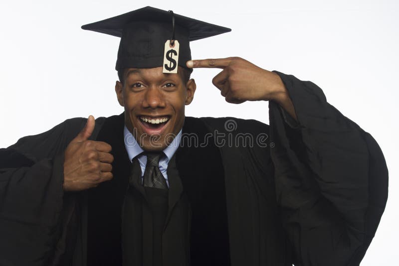 Young black man graduate with tuition price tag hanging off hat. Young black man graduate with tuition price tag hanging off hat