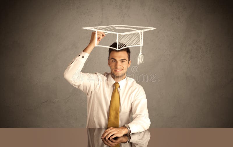 An elegant, successful university student drawing himself a square academic mortarboard cap with a chalk in front of grey wall background concept. An elegant, successful university student drawing himself a square academic mortarboard cap with a chalk in front of grey wall background concept