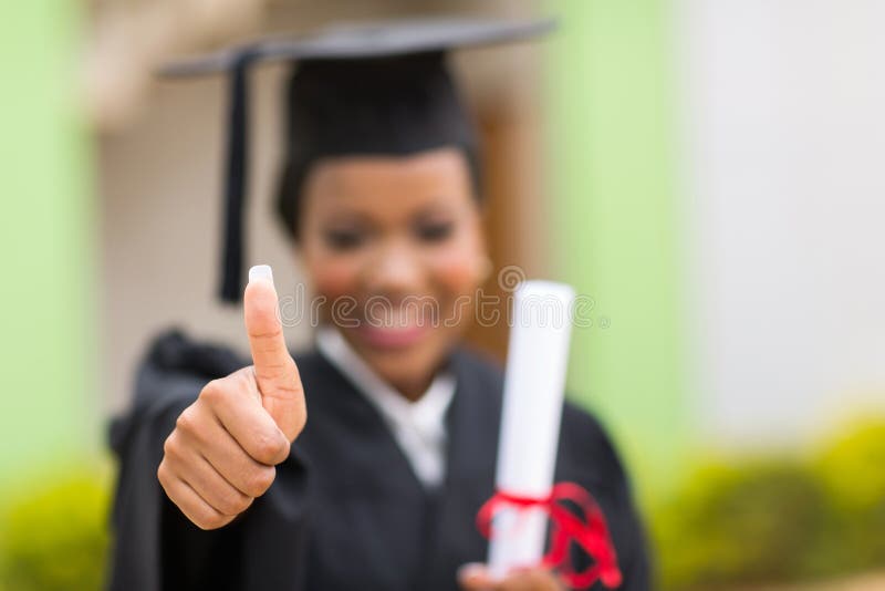 Graduate thumb up royalty free stock photography