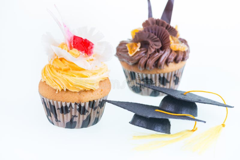 Graduatie cupcakes met het close-up van de mortierraad royalty-vrije stock afbeeldingen Graduatie cupcakes met het close-up van de mortierraad royalty-vrije stock afbeeldingen