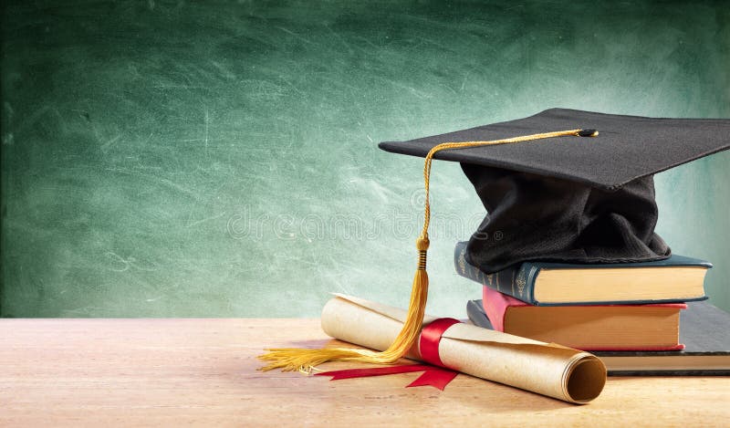 Graduation Cap And Diploma On Table