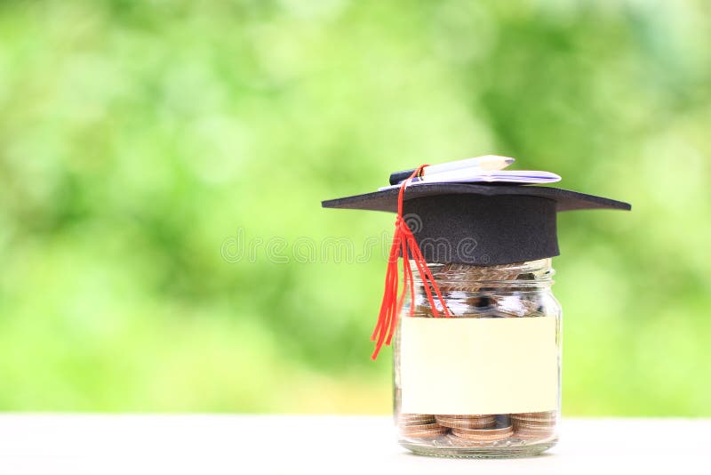 Graduation hat on the bag with Stack of gold coins money on natural green background, Saving money for education concept