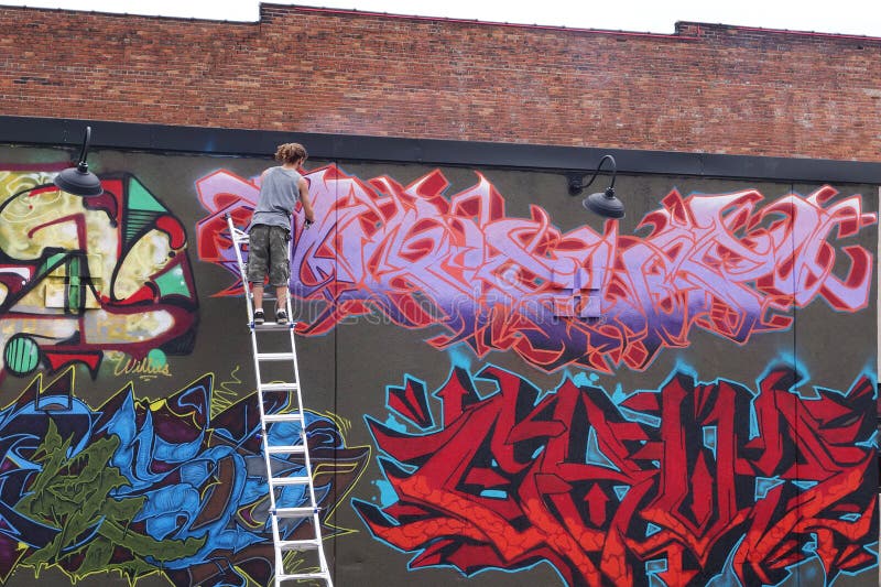 Graffiti Artist on the Ladder in Kansas City Editorial Photography