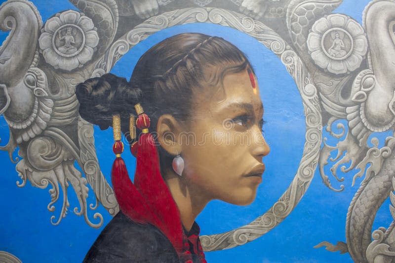 Graffiti d'une fille avec un ornement rouge dans ses cheveux sur un fond bleu avec les modèles gris photos libres de droits Graffiti d'une fille avec un ornement rouge dans ses cheveux sur un fond bleu avec les modèles gris photos libres de droits